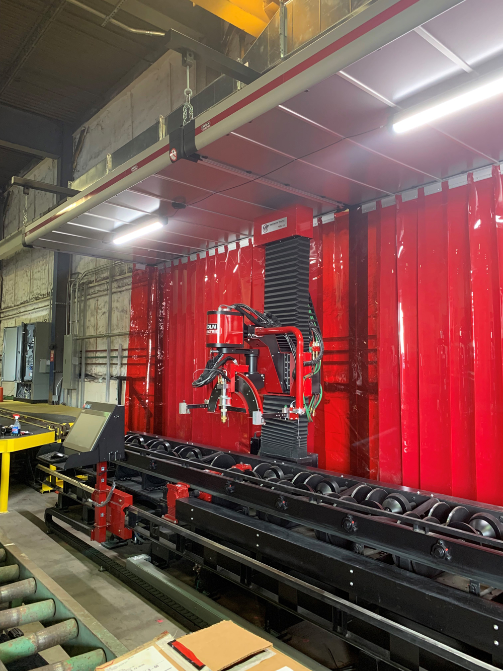 Industrial fabrication facility at Herman Goldner Co., Inc. featuring automated welding equipment and modular pipe fabrication for mechanical and plumbing construction projects.